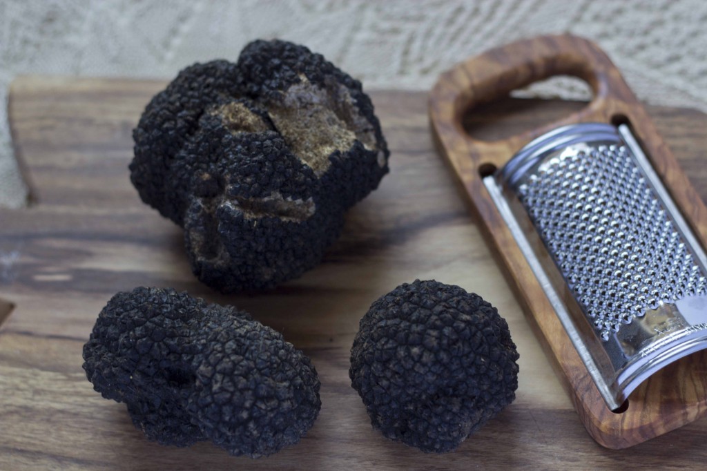 Ask around bars and restaurants to find a local truffle hunter to sell you black summer truffles