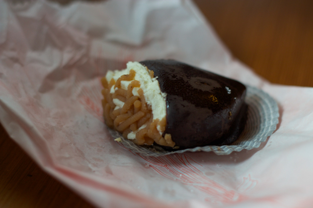 Pastry filled with cream and chestnut paste dipped in chocolate