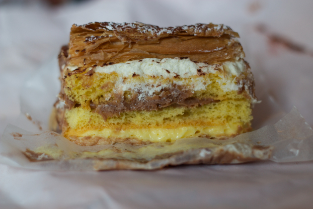 Cake and pastry layered with chocolate custard and cream