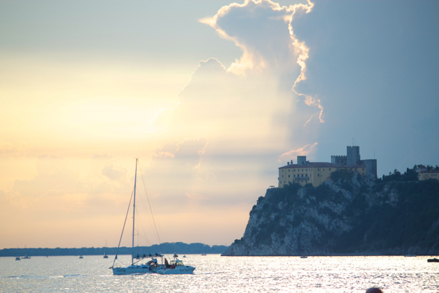 Sunset over the Adriatic Sea and Duino Castle