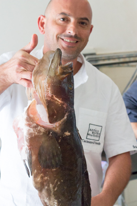 The chef at antico borgo mariner showing off his fresh fish