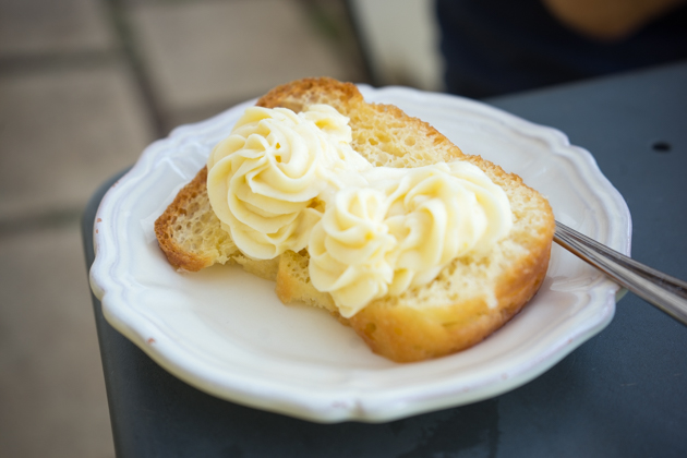 Baba al rhum (a small yeasted cake flavoured with rum and topped with pastry cream)