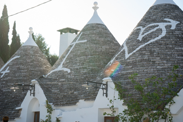 Trulli houses in Alberobello with Christian symbols whitewashed onto the roofs 