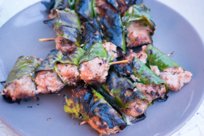 Barbecued meatballs wrapped in lemon leaves