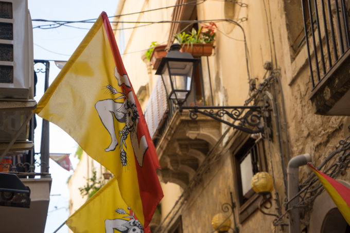 Flags bearing the Trinacria (the symbol of Sicily, Medusa's head with three legs in a triangular shape like the island of Sicily)