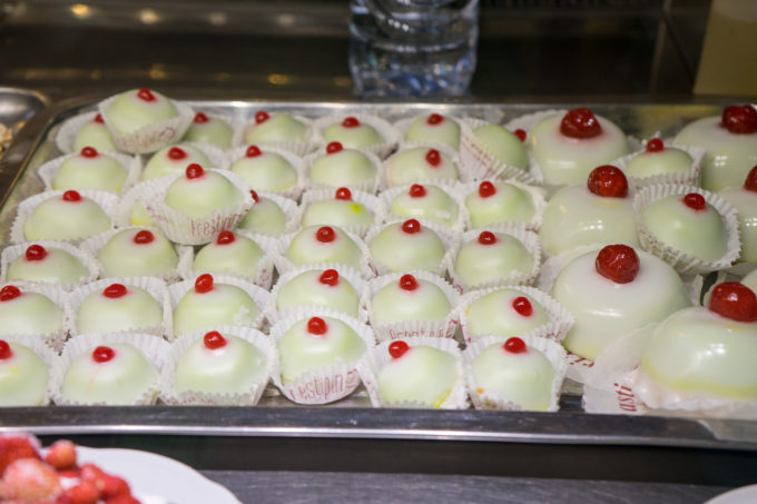 Minni di Sant'Agata (literally means Saint Agatha's breasts and are breast shaped pastries made of puff pastry, almond paste and ricotta flavoured with candies citrus and cinnamon, all topped with fondant and topped with a candied cherry)