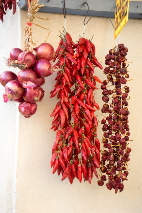 Tropea onions, spicy chillies (jokingly referred to as Calabrian viagra) and sweet chillies hanging